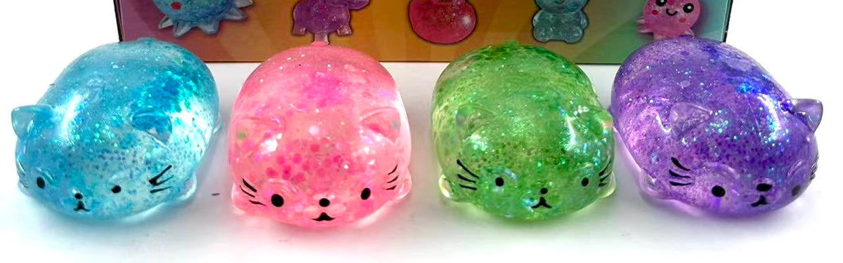 Glitter cat squishy toys in blue, pink, green and purple