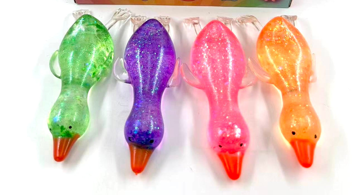 Stretchy glitter flat duck squishy toys in green, purple, pink and orange