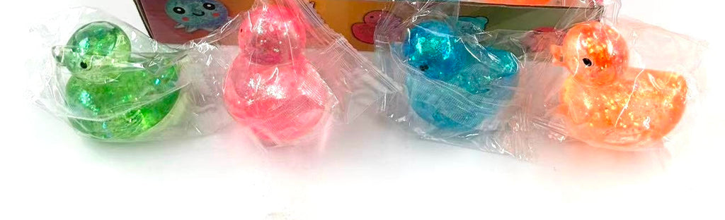 Glitter rubber ducky squishy toys in green, pink, blue and orange